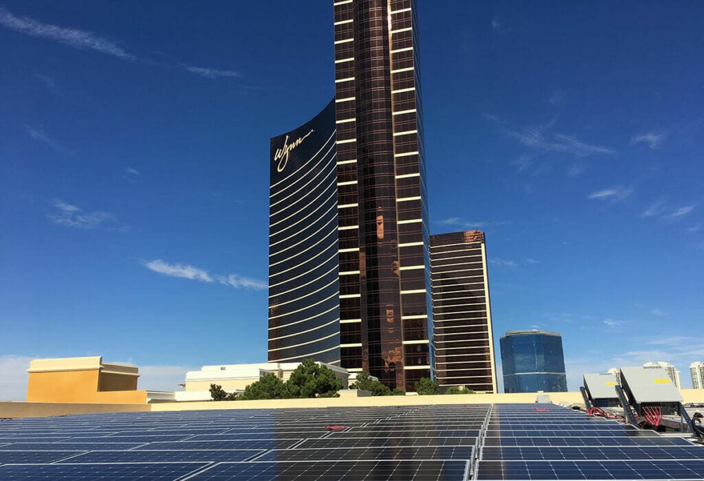 Solar panels on rooftop with Wynn resort in background